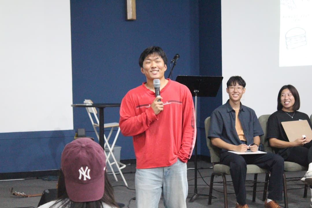 A student sharing with the group at a 1128 College gathering